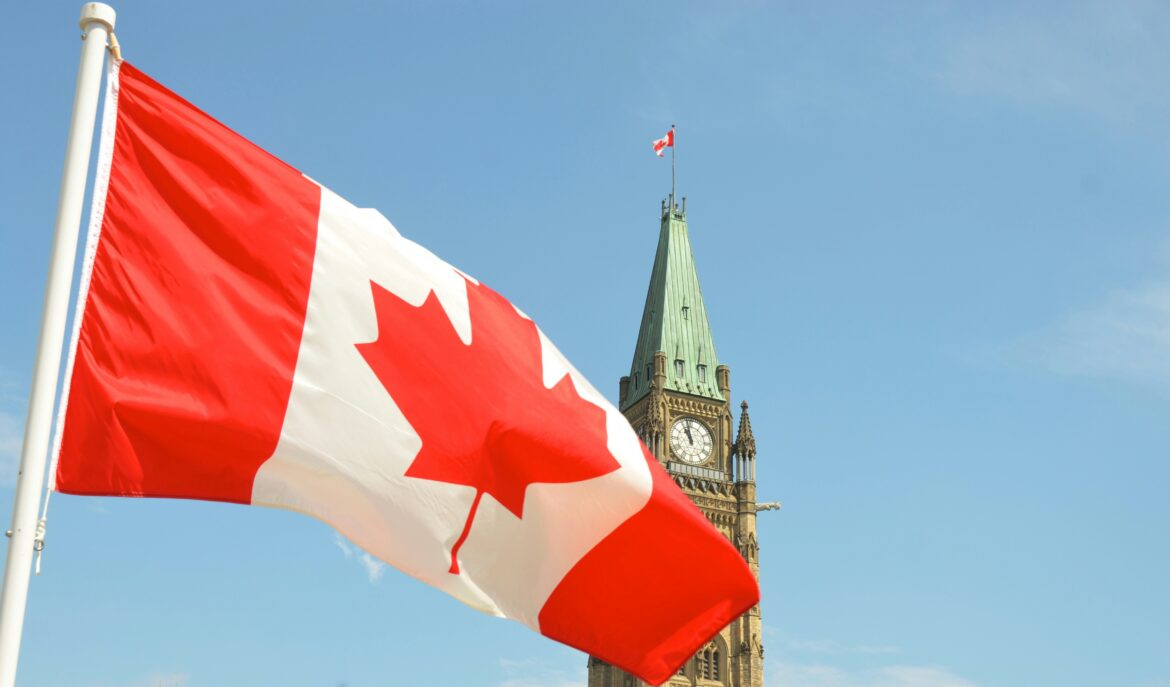 Canadian flag in front of Parliament Hill in Ottawa